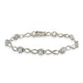 Glitzy Rocks Sterling Silver Diamond Accent Blue Topaz Infinity Bracelet