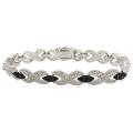 Fusion Black and Silvertone Diamond Accent 'X' Bangle Bracelet