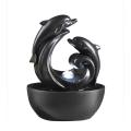 The Delfini Tabletop Dolphin Water Fountain With Led Light and Glass Sphere