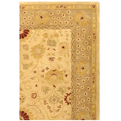 Handmade Timeless Ivory/ Sand Wool Rug (9' x 12')