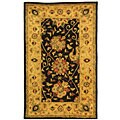 Handmade Antique Mashad Black/ Ivory Wool Rug (3' x 5')