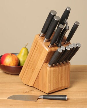 Set of cutlery and steak knives in a storage block