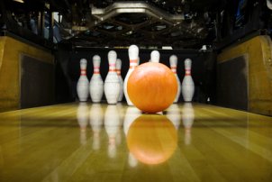 Bowling ball about to hit the pins