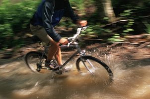 Biking through a puddle