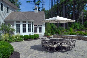 Striped patio umbrella in the center of a table