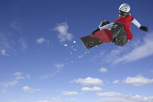 Snowboarder wearing a snowboard helmet