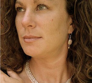 Woman with gold earrings