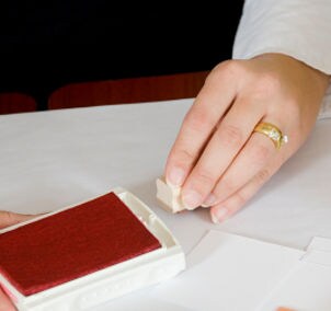 Woman using a rubber stamp