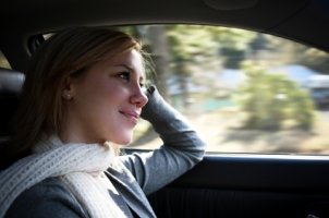 Woman listening to her car stereo