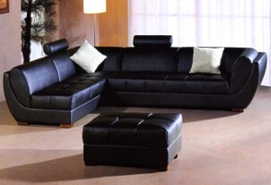 Living room decorated with black, leather furniture