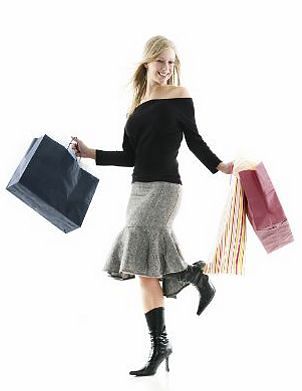 Woman wearing a skirt and carrying shopping bags