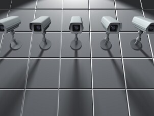 Security cameras mounted on a wall