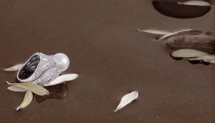 A gorgeous romantic vintage ring with one big pearl and a smattering of accent diamonds