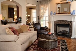 Open family room with sofa, chair and ottoman