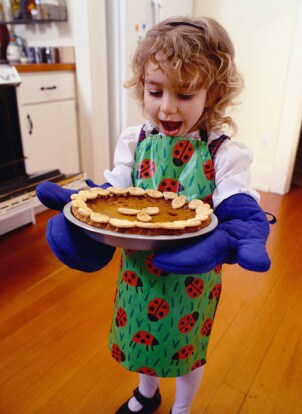 Girl holding a fresh baked pie