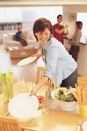 Woman setting a table