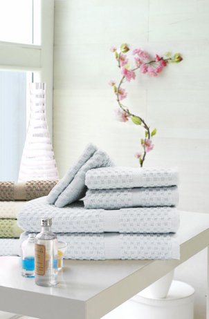 Bath towels stacked on a table