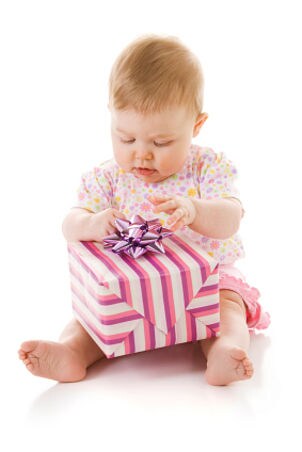 Baby girl with wrapped gift
