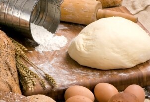 Rising bread dough on a cutting board