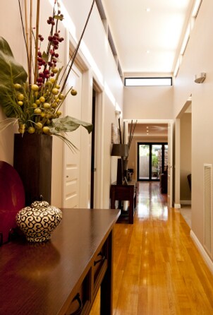 A hallway with maple hardwood flooring