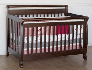 Wooden baby crib with bedding