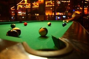 Green felt billiards table