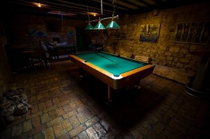 Billiard table with cues and balls