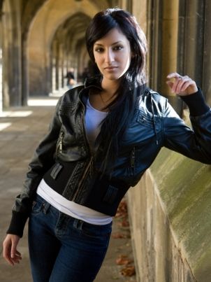 Woman wearing a leather motorcycle jacket