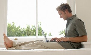 Man using a laptop computer with flash memory