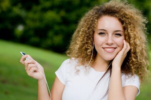 Girl listening to music with headphones