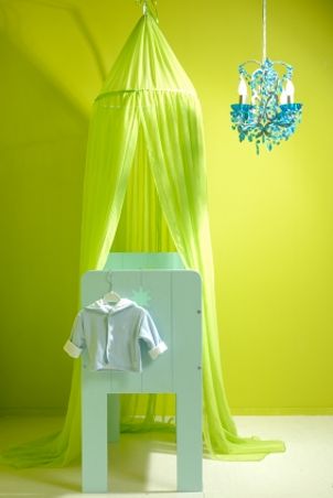 Trendy baby crib in a lime green nursery