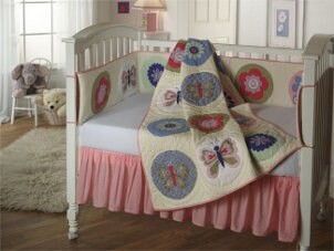Baby nursery filled with cute baby furniture