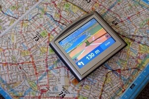 GPS device sitting on a paper map