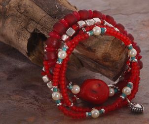 A pretty red beaded charm bracelet