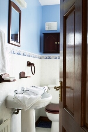 Blue bathroom with a pedestal sink