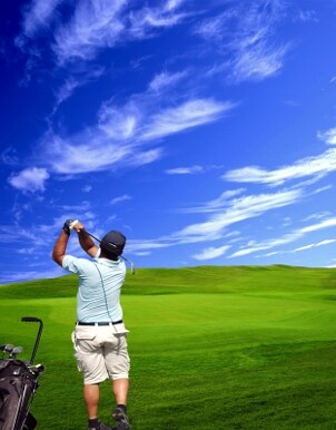 Golfer watching his drive