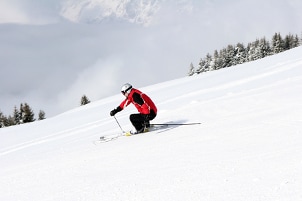 Skier in red ski jacket