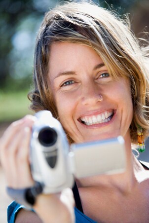 Woman filming with a Samsung camcorder