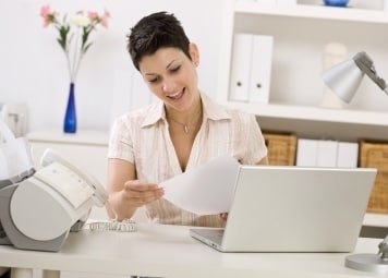 Woman using an all-in-one printer