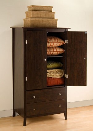 Bedroom armoire with blankets and pillows inside