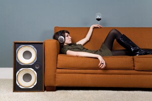 Woman listening to an original soundtrack on headphones