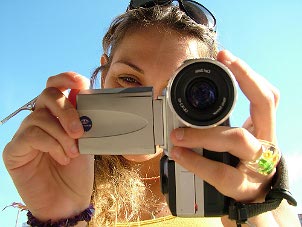 Girl shooting with a digital camcorder