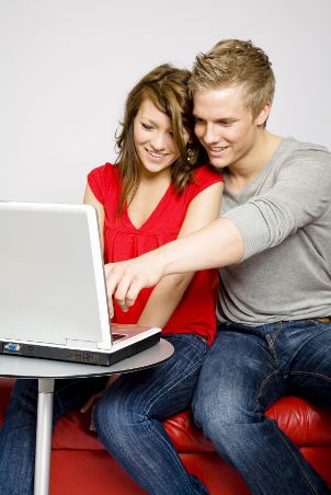 Young couple setting up a bridal registry