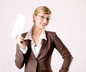 Woman holding a regular letter envelope