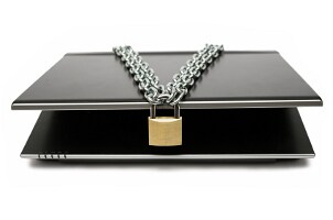 Black DVR draped with a chain and padlock