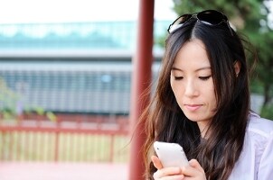 Girl downloading apps to her iPhone