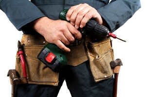 Artisan holding a power drill with a drill bit