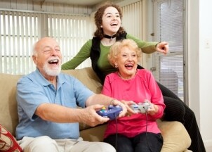 Old folks enthusiastically playing a video game