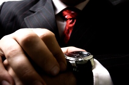 Man checks the time on his Stuhrling Original watch