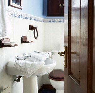 Chrome bathroom faucet on a pedestal sink